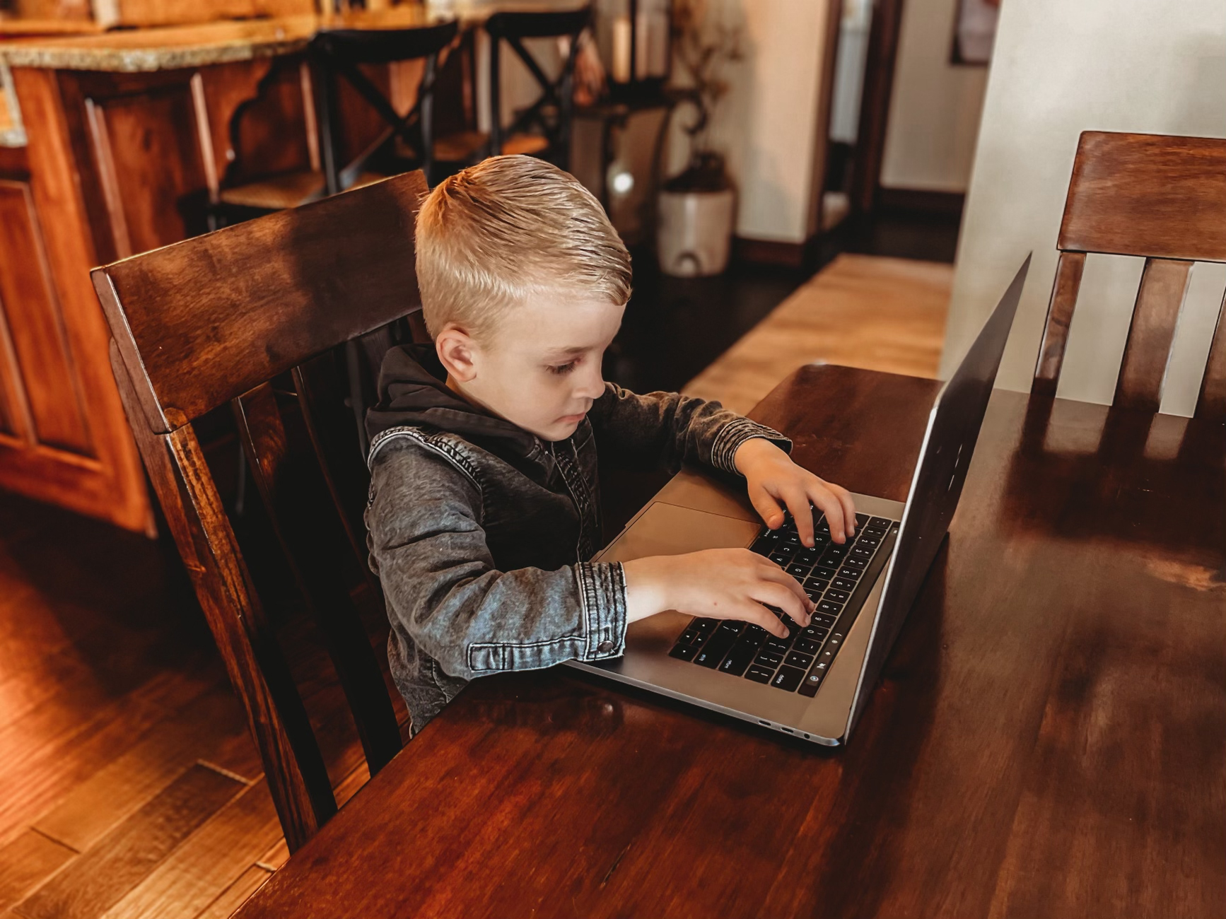 child on laptop computer